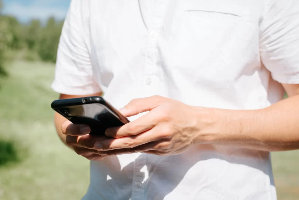 close up of male hands browsing the internet on a utc