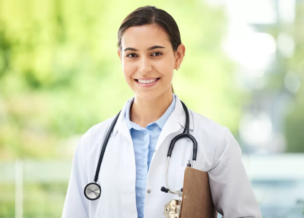 confident young mixed race female doctor standing utc