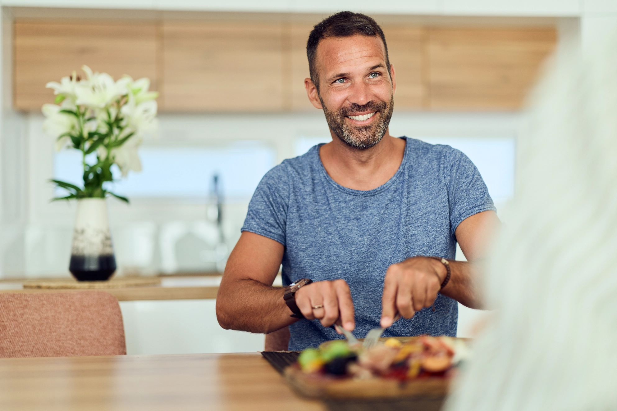 Smiling man enjoying a meal